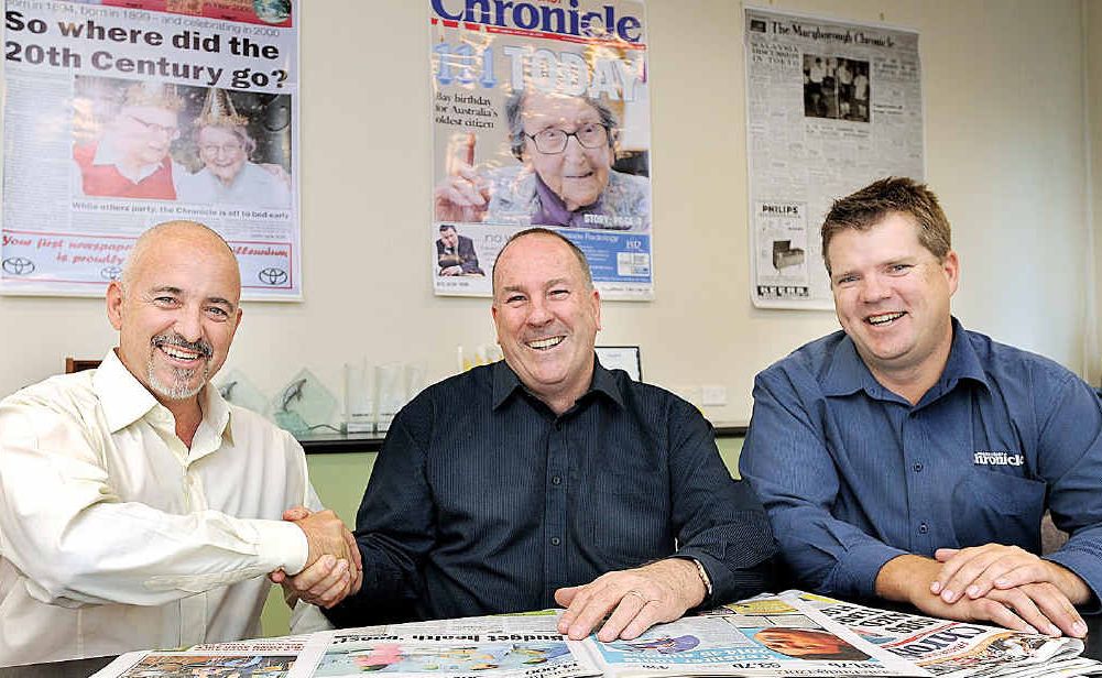Mat Nott, the new Fraser Coast Chronicle editor, is congratulated by Peter Chapman, the new APN group editor for business, food, travel and shopping, and general manager Darren Bosley. Mat Nott, the new Fraser Coast Chronicle editor, is congratulated by Peter Chapman, the new APN group editor for business, food, travel and shopping, and general manager Darren Bosley.
